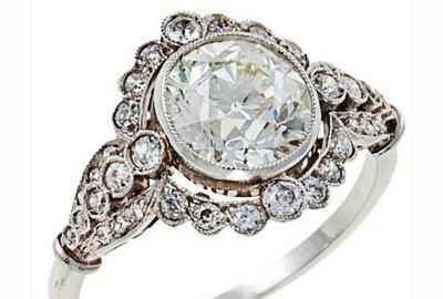 vintage engagement ring bezel set with diamonds halo 