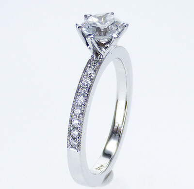 Pave set side diamonds Novo engagement ring