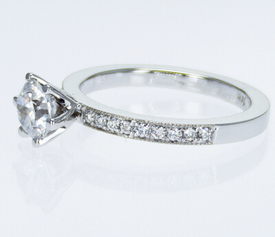 Pave set side diamonds Novo engagement ring