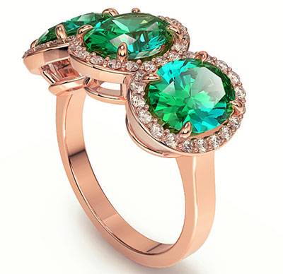 Three Emerald Ovals ring with side diamonds