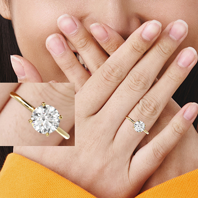 Anillo de compromiso solitario con diamante redondo amarillo.