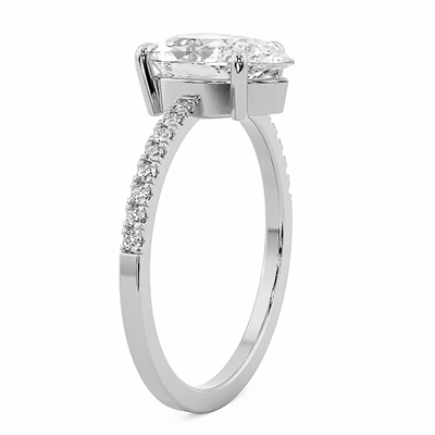 Low profile pear shaped diamond engagement ring