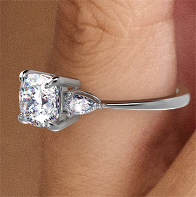 Three stone engagement ring with Cushion center & 0.20CTW side Pear diamonds