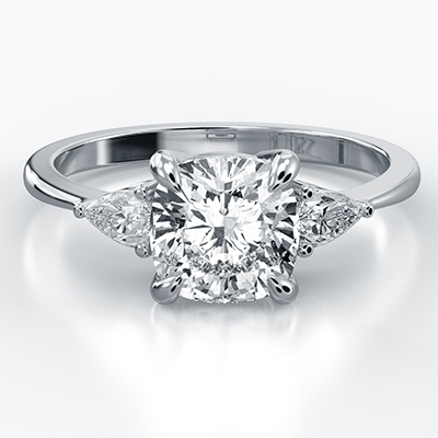 Three stone engagement ring with Cushion center & 0.20CTW side Pear diamonds